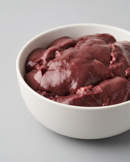 Beef Liver — A bowl of smooth, deep maroon beef liver with a dense glossy surface