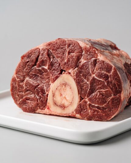 Beef Shin — A cross-cut beef shin slice with a round marrow bone at its center surrounded by dense muscle