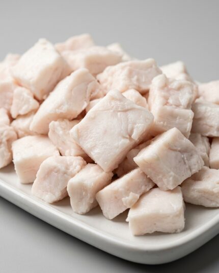 Lamb Fat — Chopped, firm white lamb fat pieces with an opaque, waxy texture piled together