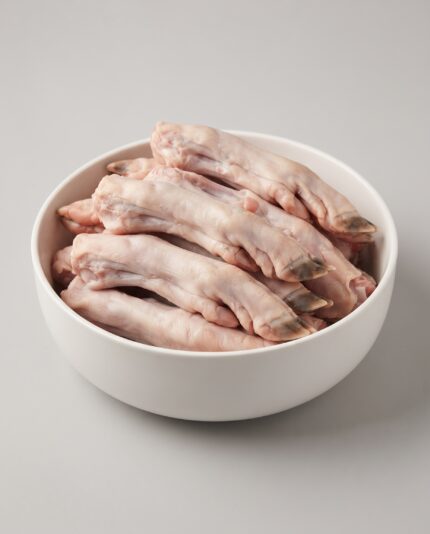 Lamb Feet — A pile of pale, slender lamb feet with visible small hooves and thin skin