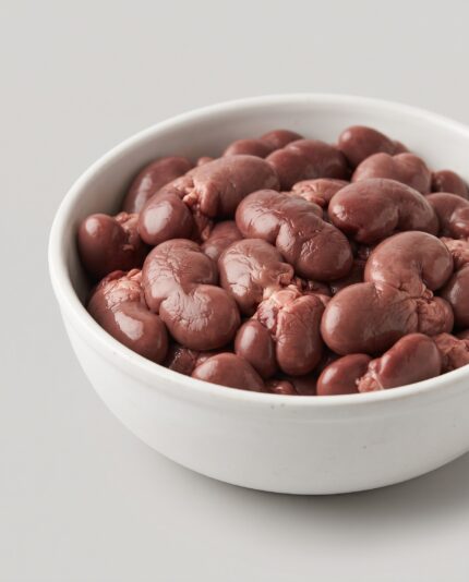 Lamb Kidney — A bowl of small, bean-shaped lamb kidneys with a characteristic lobed surface