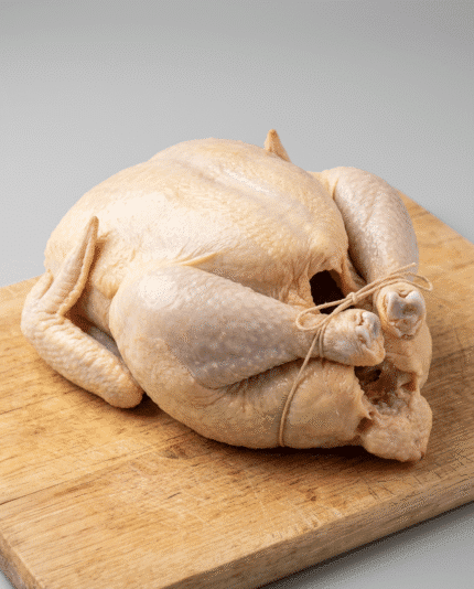 Whole Chicken 1000 on a wholesale cutting board