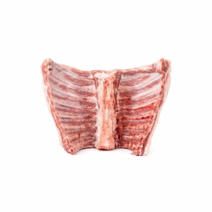 A raw lamb best end on a white background
