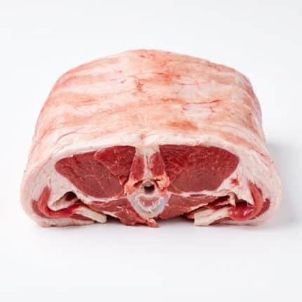 A raw lamb chine, cut face showing the two loin eyes